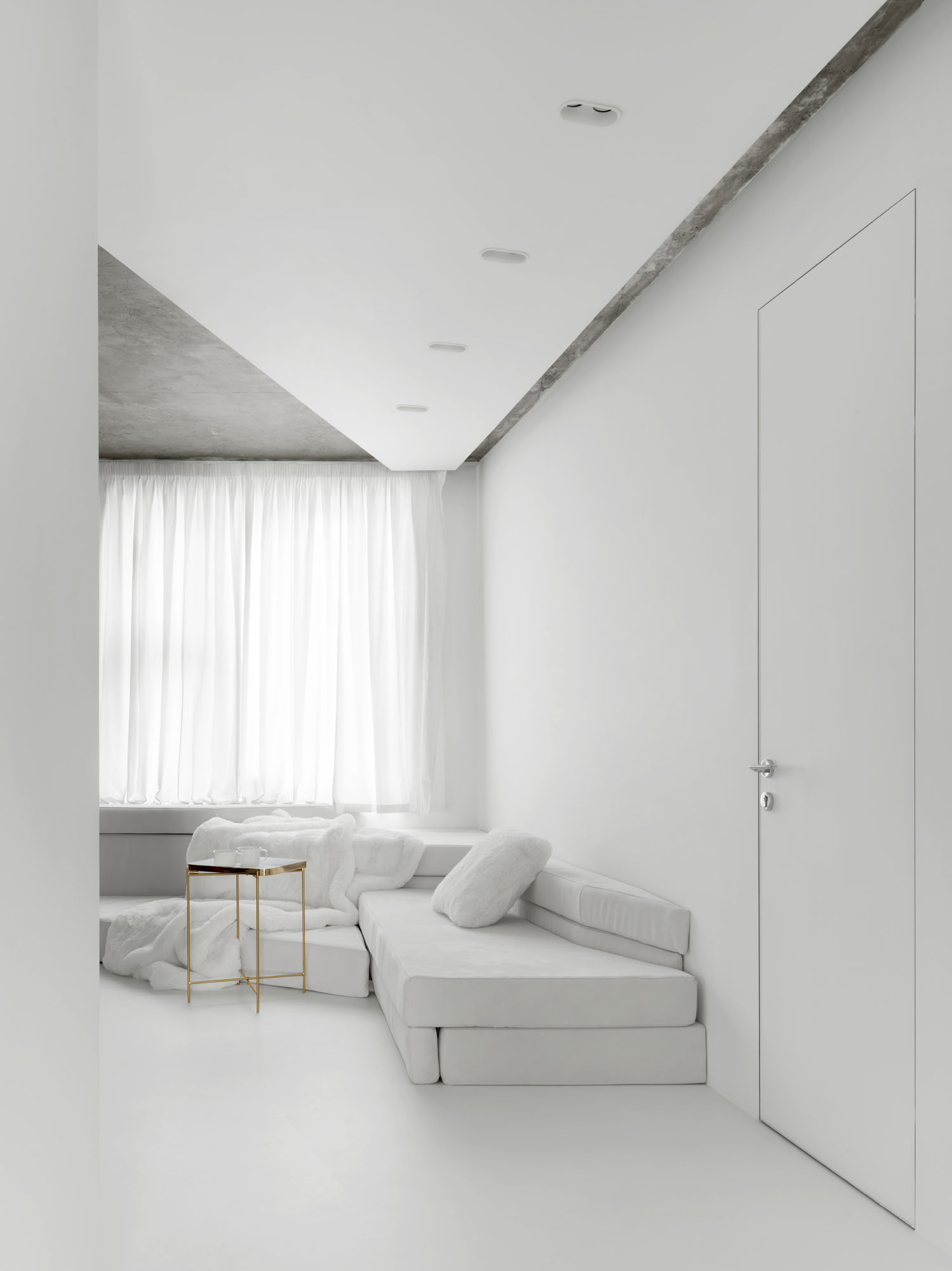 interior of an apartment with white walls and furniture