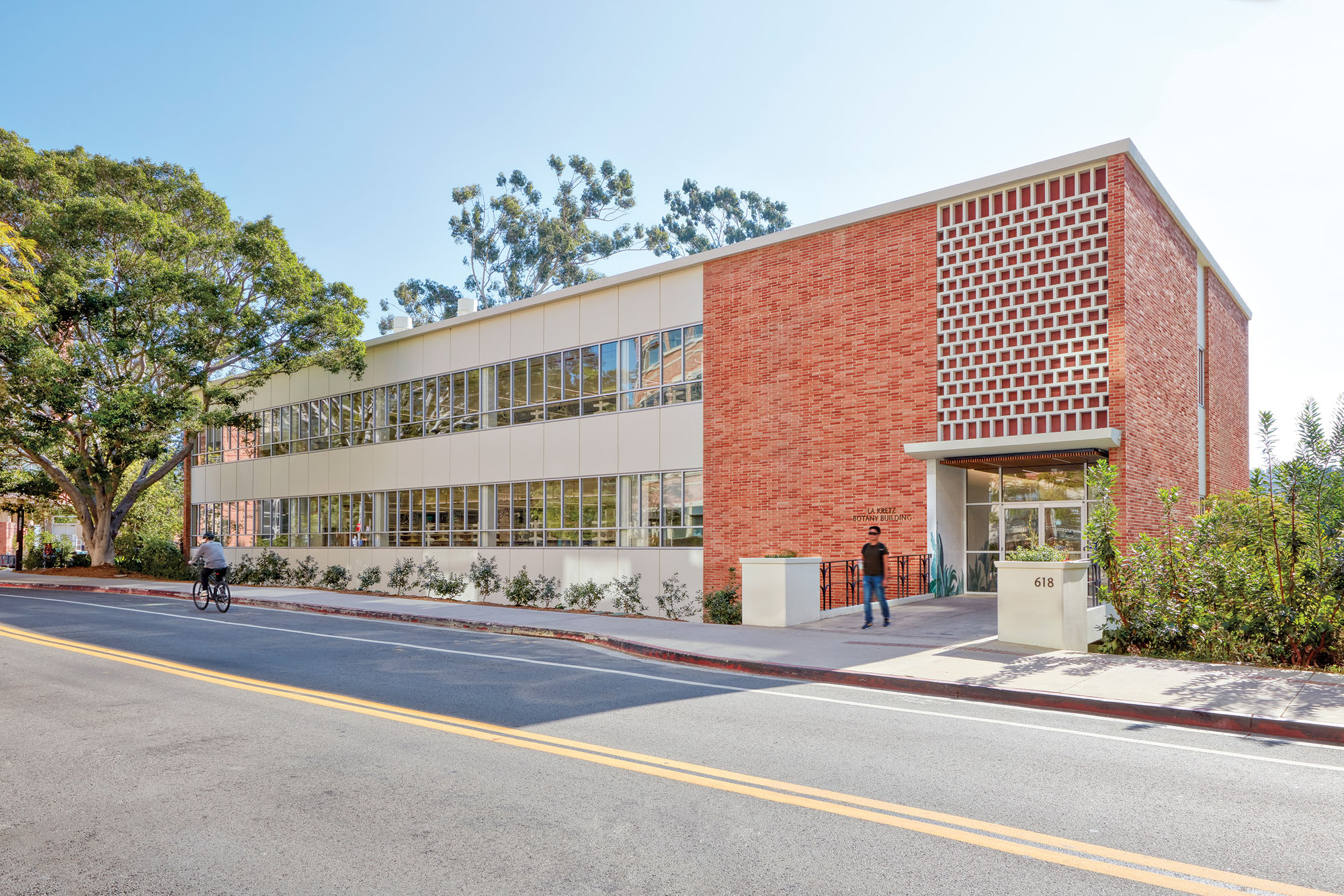 a photograph of the exterior of a brick building on the UCLA campus