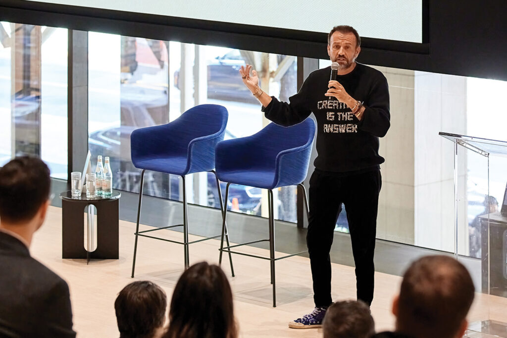 a photograph of Mauro Porcini speaking at Design Optimism in New York City