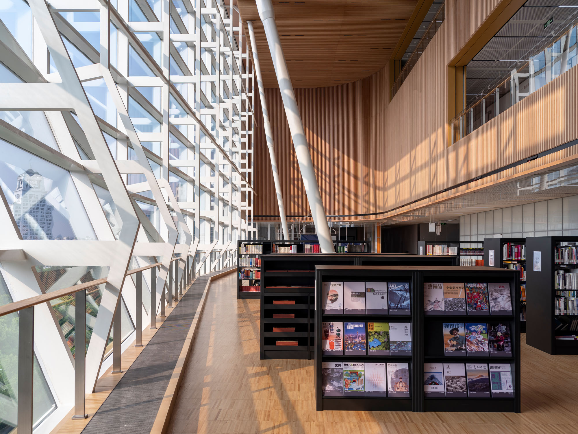A photograph of the interior of the Shanghai East Library where there are books on shelves
