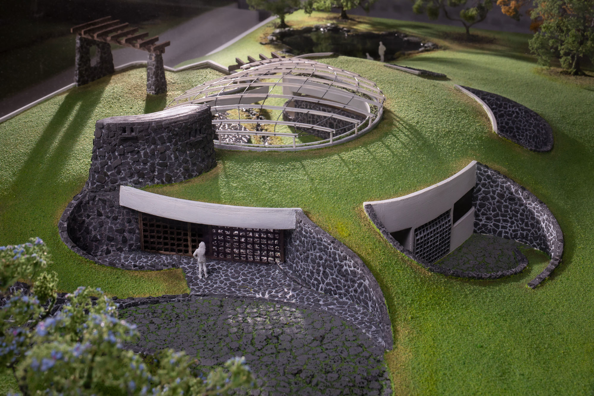 detail image of an architectural model with a scale figure on a green roof