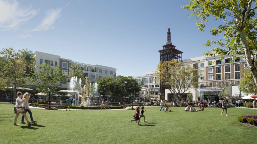 The Americana at Brand a shopping mall with a greenspace where people are walking