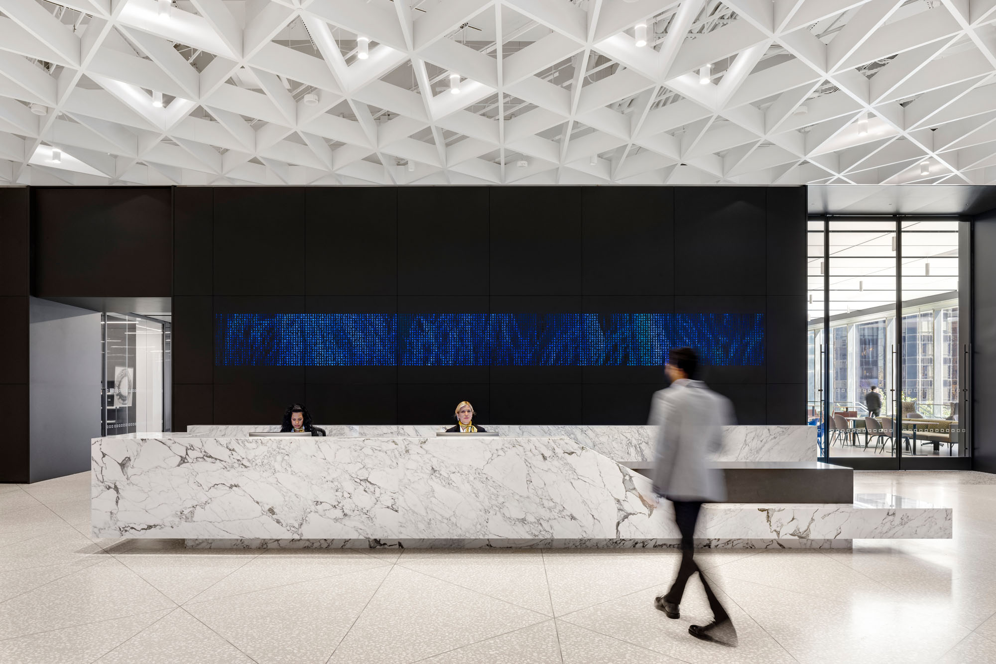 a photograph of the stone reception desk at Deutsche Bank's headquarters