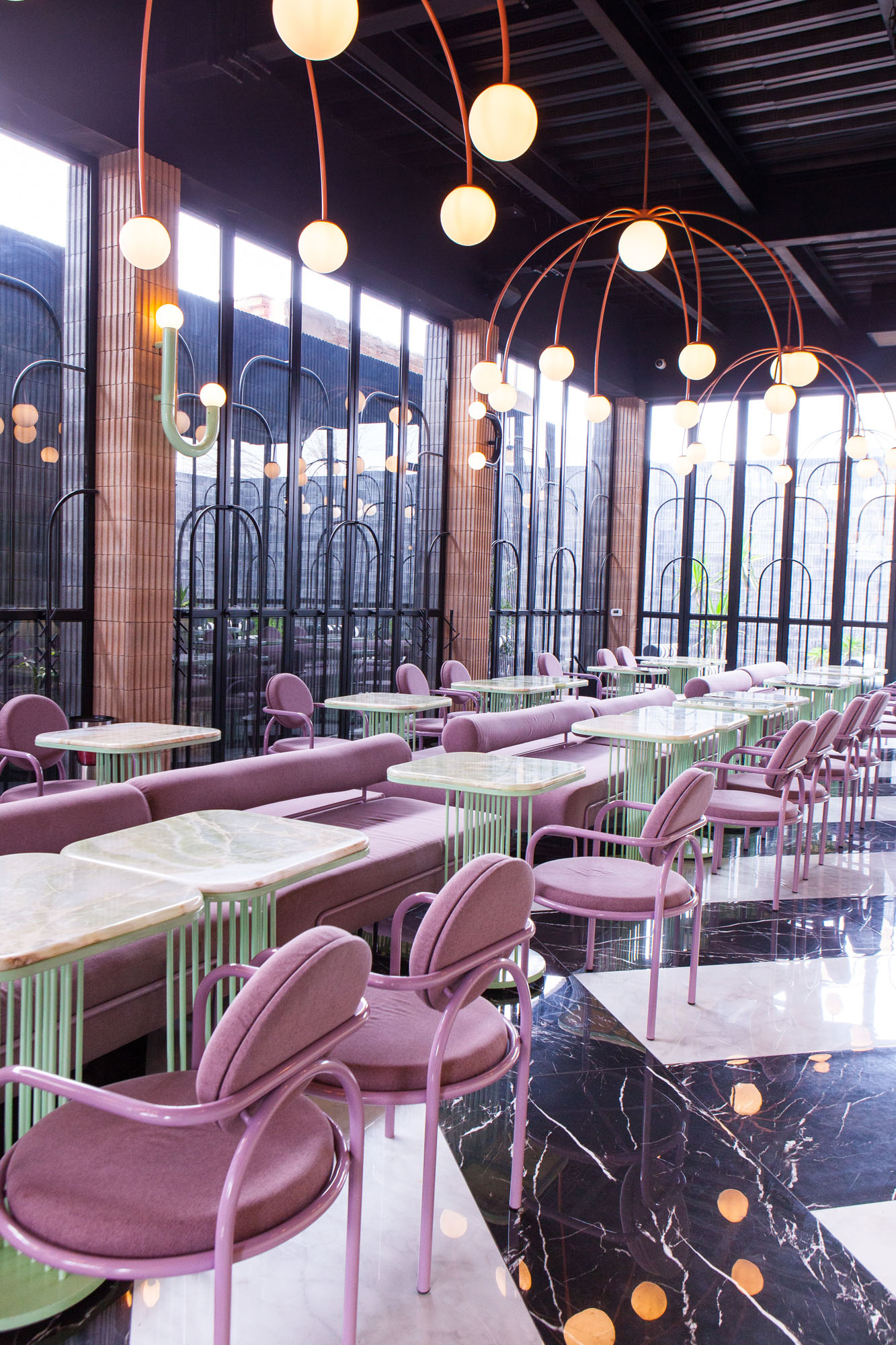 interior of a restaurant showing pastel colored tables