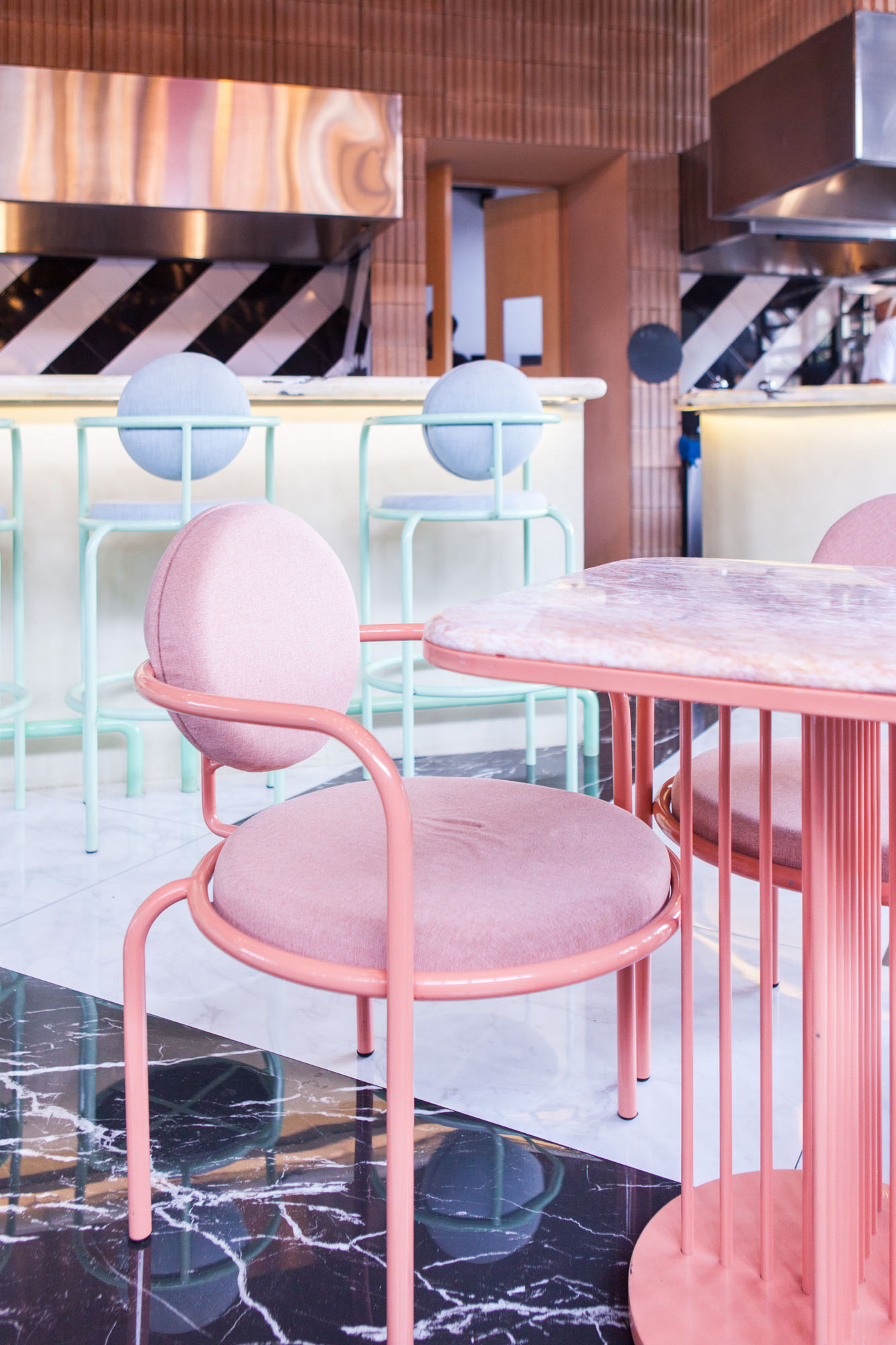 an image of a pastel pink dining table