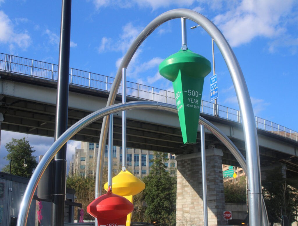 colorful sculptural instillation points to rising sea level