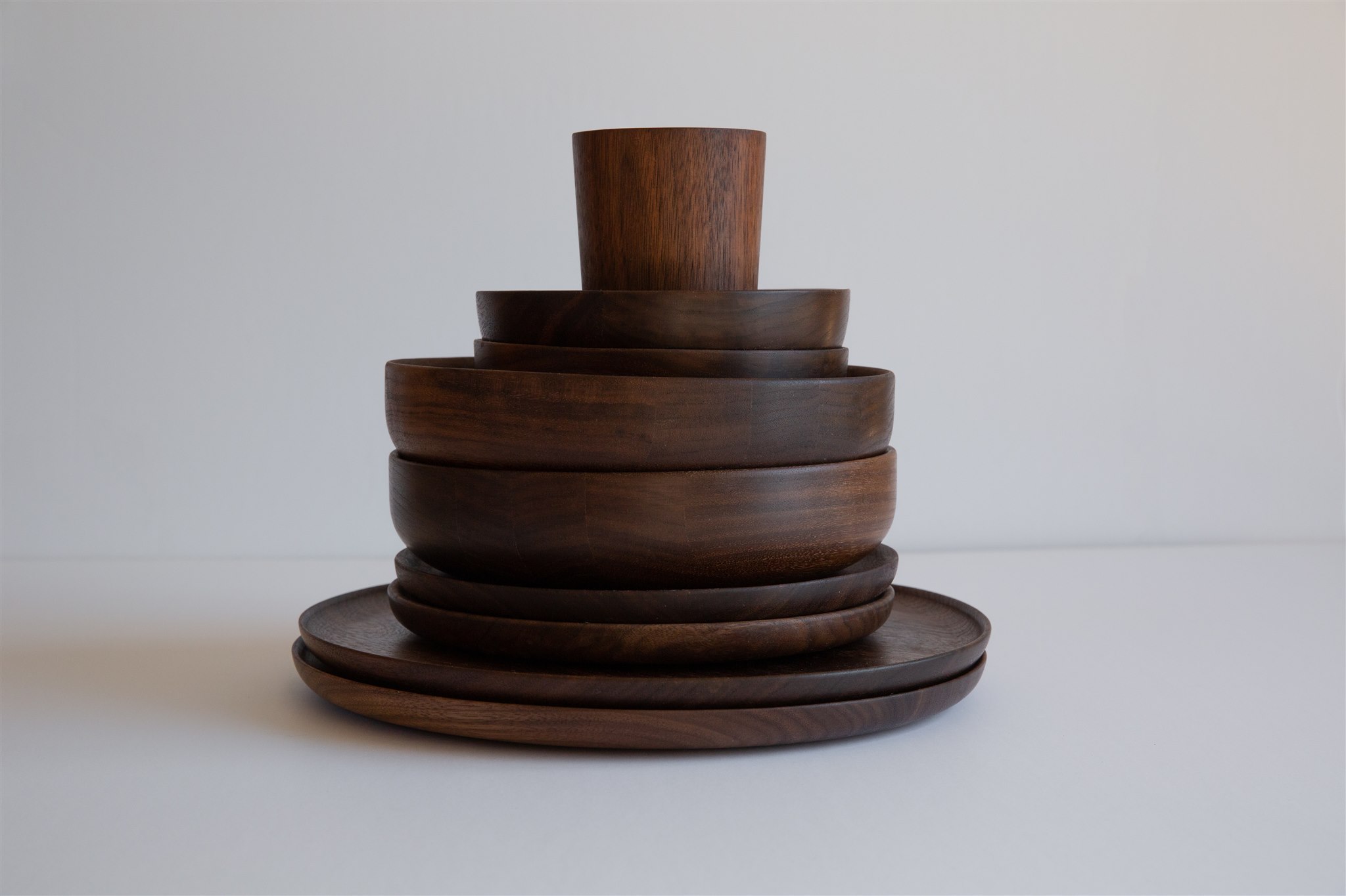 a stack of wooden tableware