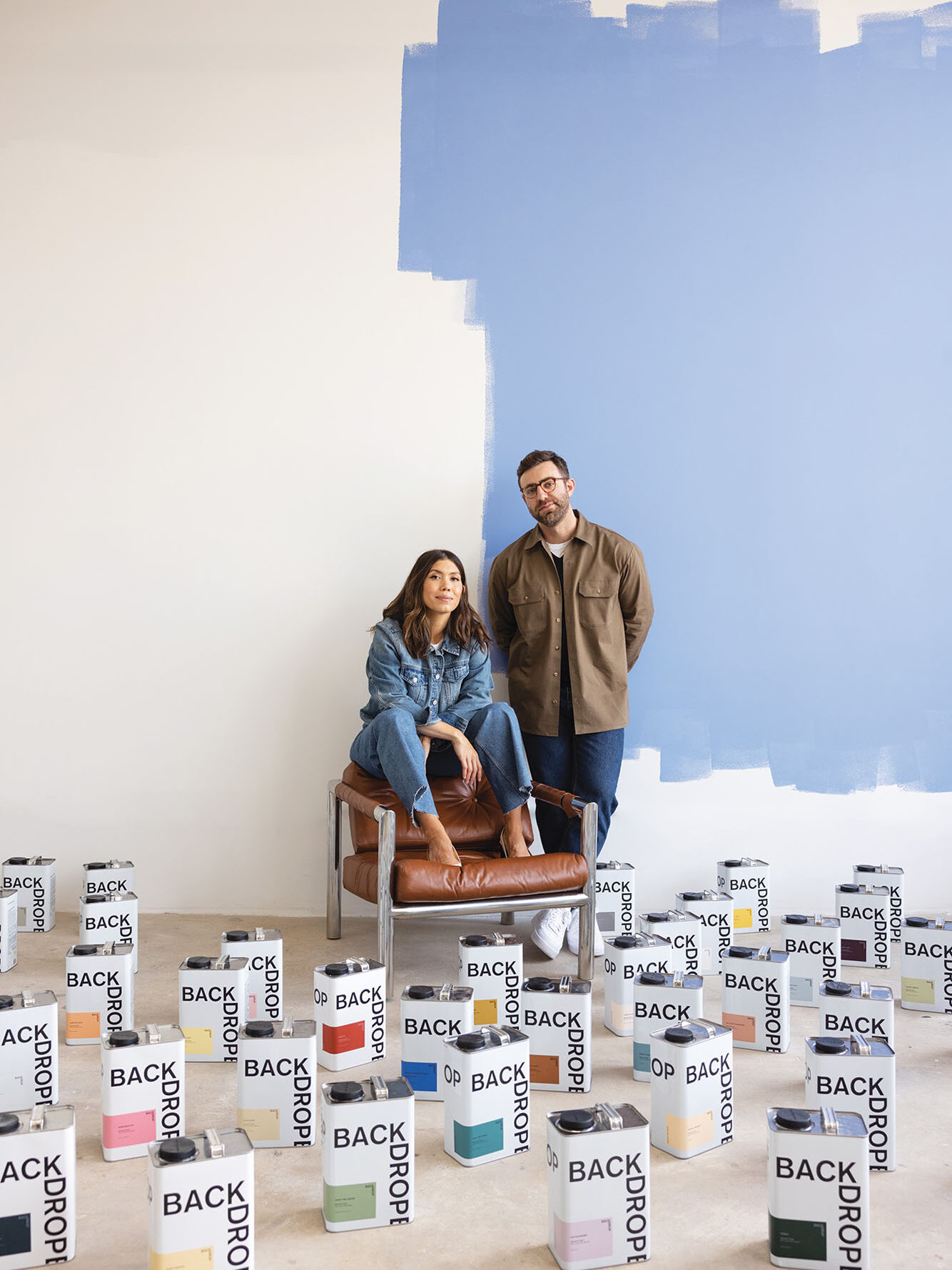 two people sitting in front of paint samples