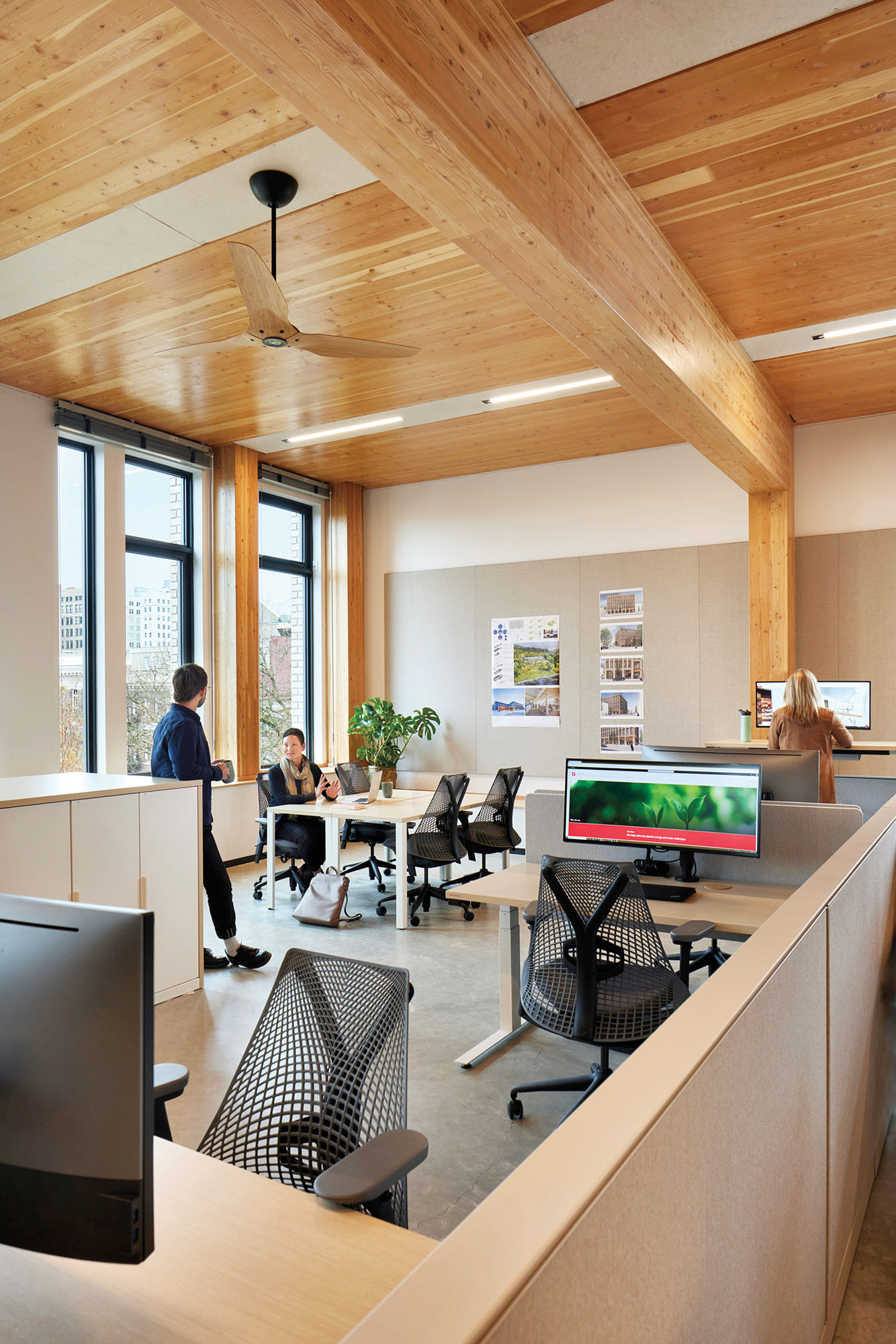 A photograph of workstations inside the PAE Living Building in Portland, Oregon