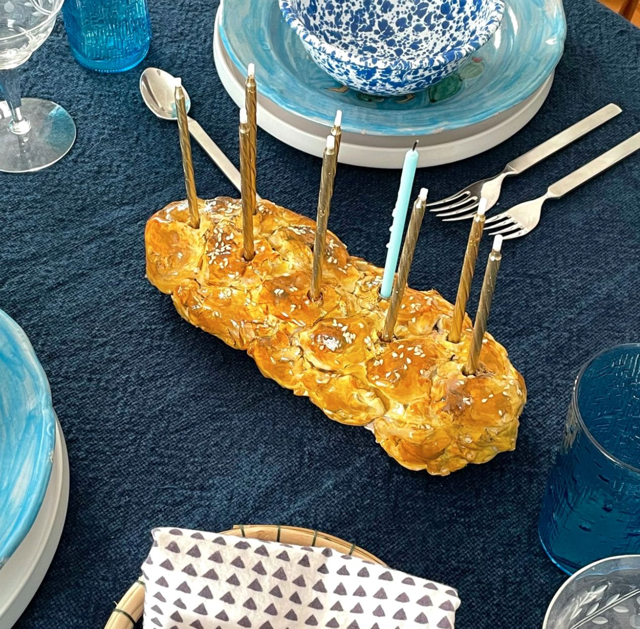 a menorah in the shape of challah